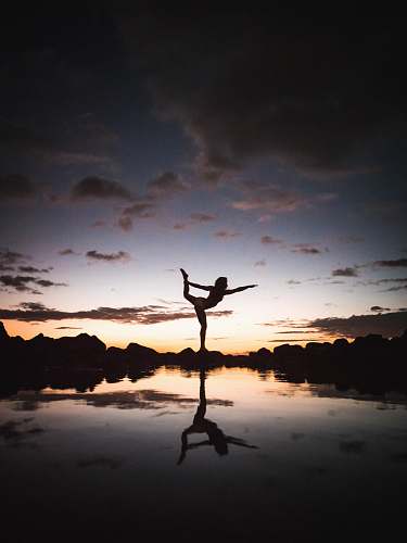 leisure activities silhouette photography of woman doing yoga dance pose